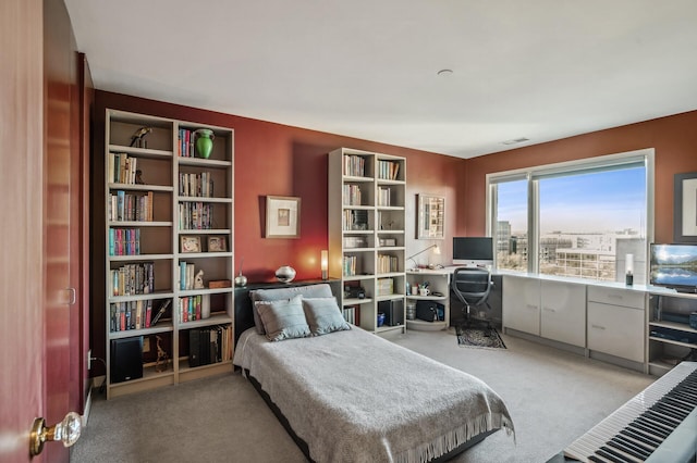 bedroom with light colored carpet