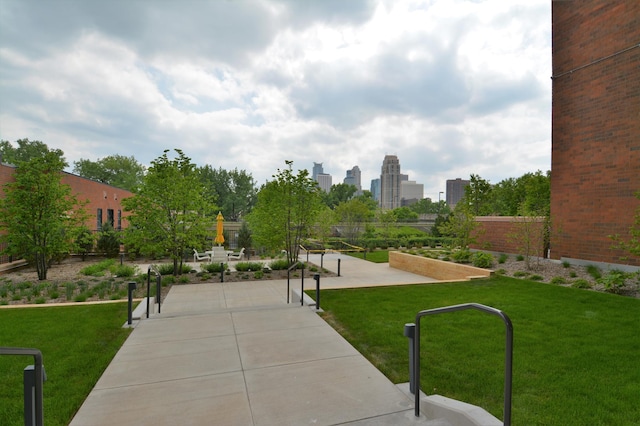 view of property's community with a lawn