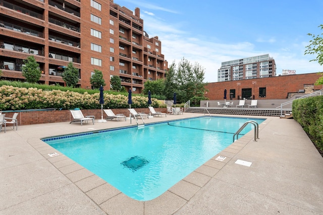 view of swimming pool featuring a patio