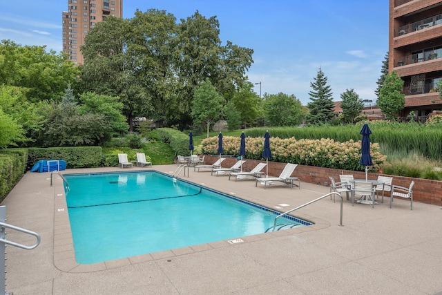 view of pool featuring a patio area