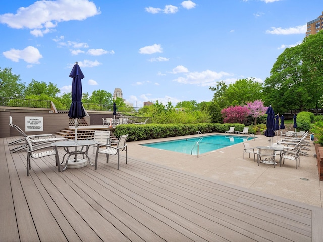 view of swimming pool with a patio