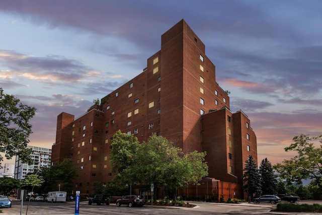 view of outdoor building at dusk