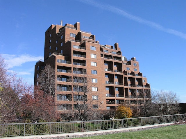 view of property with fence