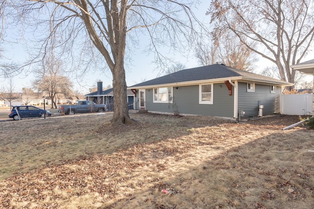 rear view of house featuring a lawn