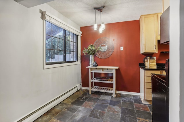 dining area with a baseboard heating unit