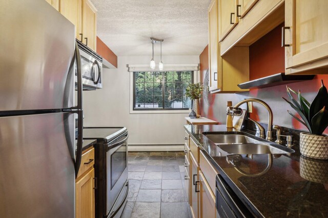 kitchen featuring sink, stainless steel appliances, decorative light fixtures, and light brown cabinets