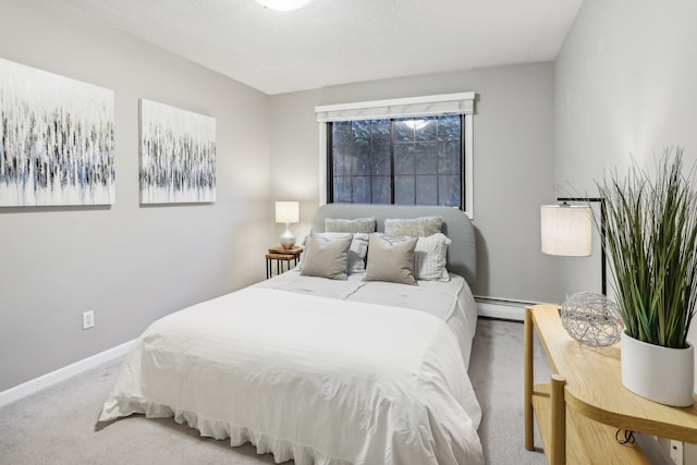 bedroom featuring carpet floors and a baseboard radiator