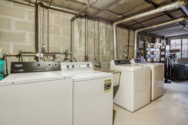 clothes washing area featuring independent washer and dryer