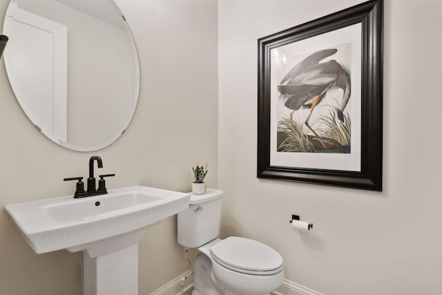 bathroom featuring sink and toilet