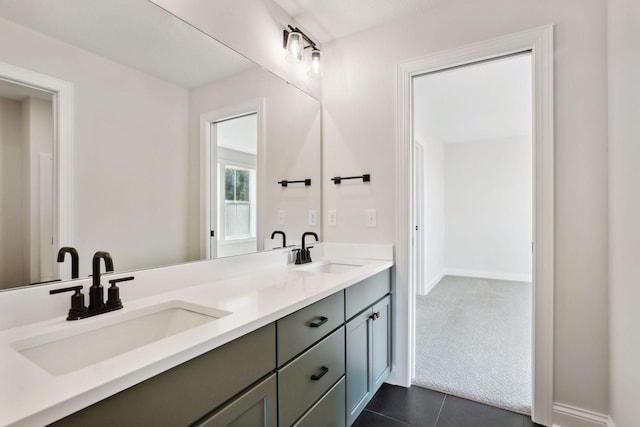 bathroom with vanity and tile patterned flooring