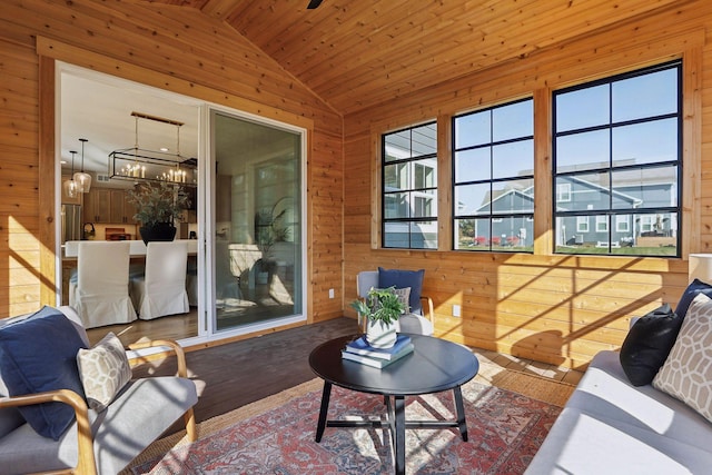 sunroom with lofted ceiling, a chandelier, and wooden ceiling