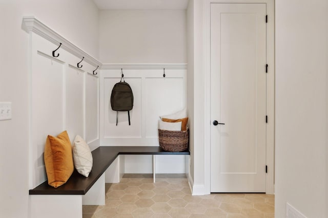 mudroom with light tile patterned floors