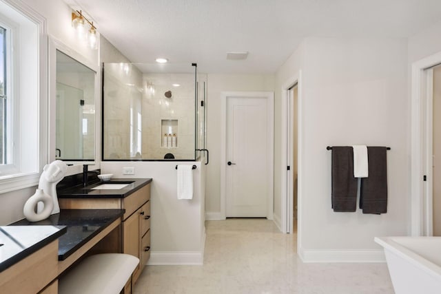 bathroom featuring an enclosed shower and vanity