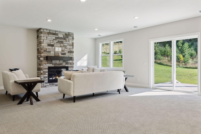 carpeted living room with a fireplace