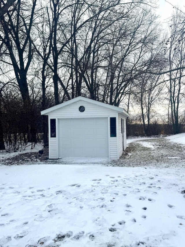 view of snow covered garage