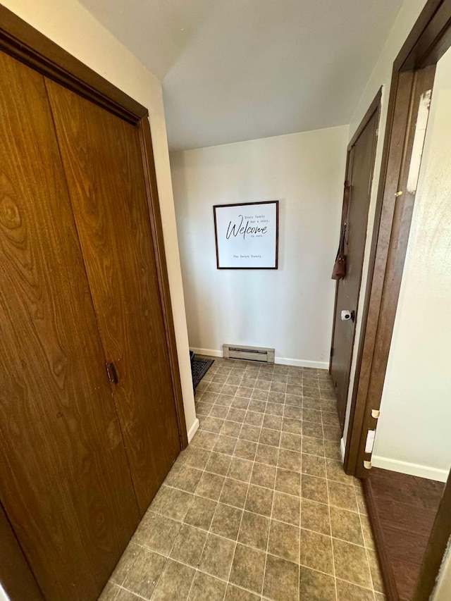 hallway featuring a baseboard heating unit