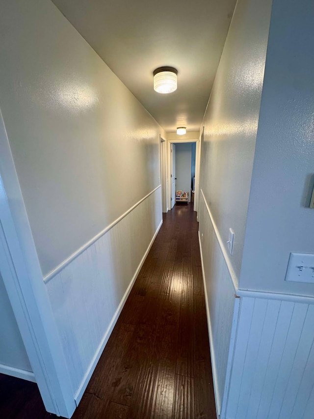 hall with dark hardwood / wood-style floors