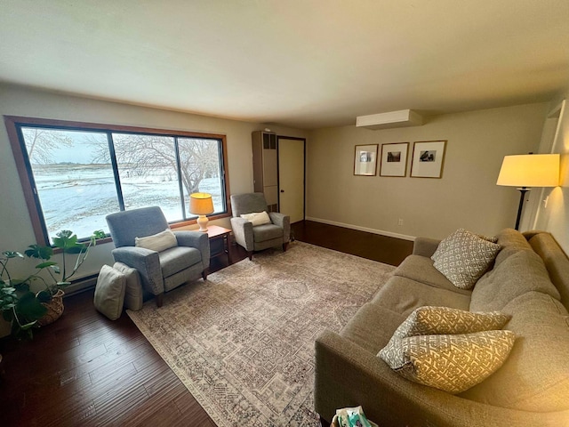 living room with hardwood / wood-style flooring and a wall mounted AC