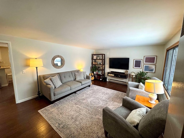 living room featuring dark wood-type flooring