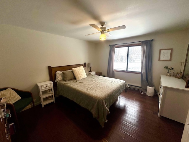 bedroom with ceiling fan, dark hardwood / wood-style floors, and a baseboard radiator