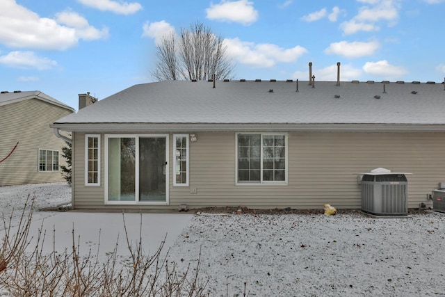 rear view of house with central AC