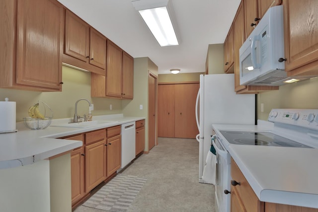 kitchen featuring white appliances and sink