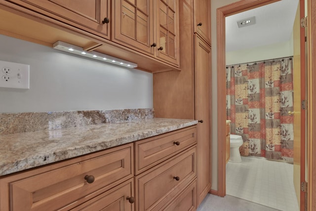 kitchen with light stone countertops