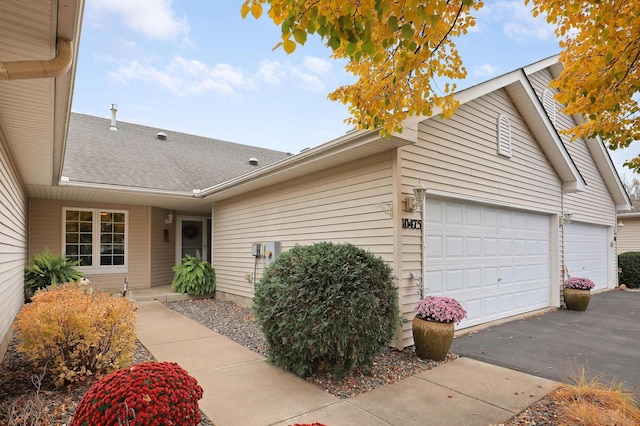 ranch-style house featuring a garage