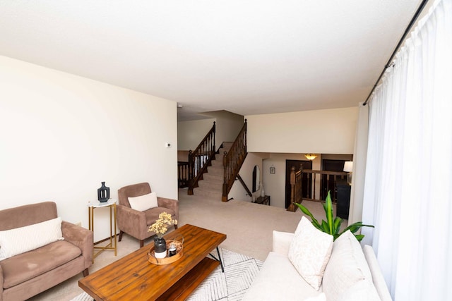 carpeted living room featuring a healthy amount of sunlight