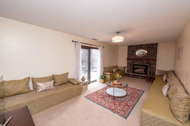 carpeted living room with a fireplace and a textured ceiling