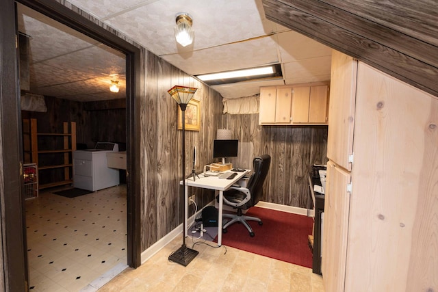 office space with washer and dryer and wood walls