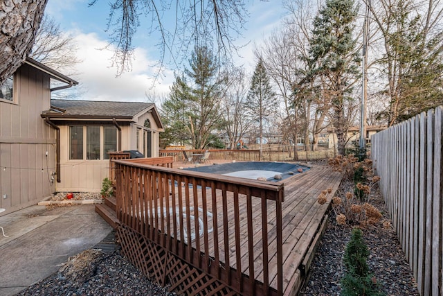 deck with a hot tub