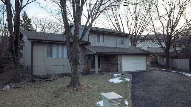 view of front of house featuring a garage and a front yard