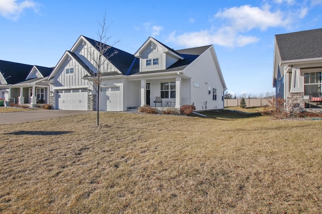 view of front of house with a garage and a front yard