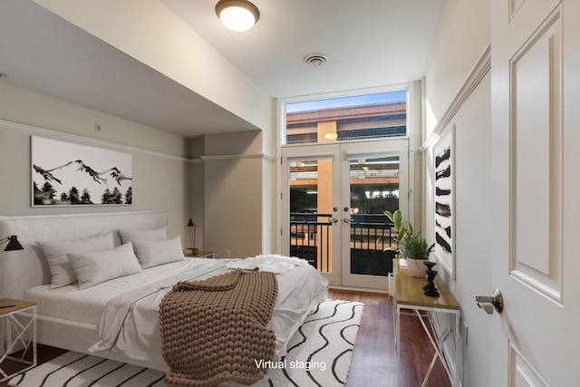 bedroom featuring french doors, access to outside, and dark wood-type flooring