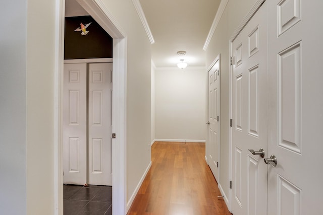 hall with crown molding and dark hardwood / wood-style floors