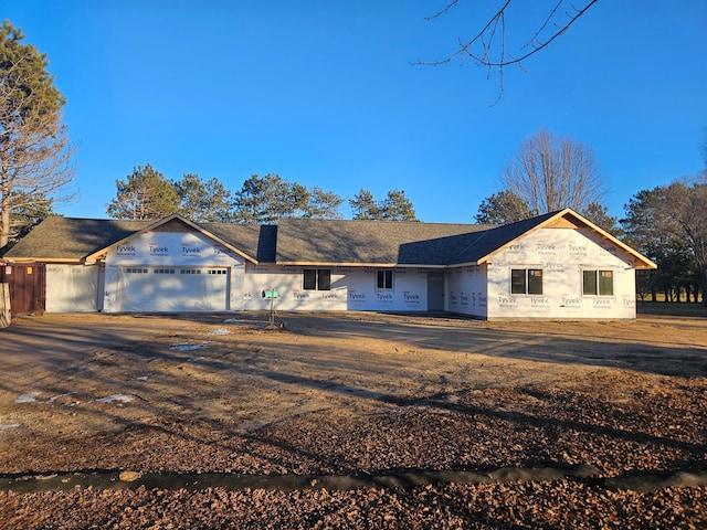 property in mid-construction with a garage