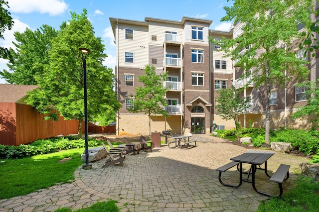 surrounding community featuring a patio area