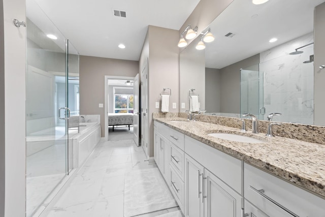 bathroom featuring plus walk in shower, vanity, and ceiling fan