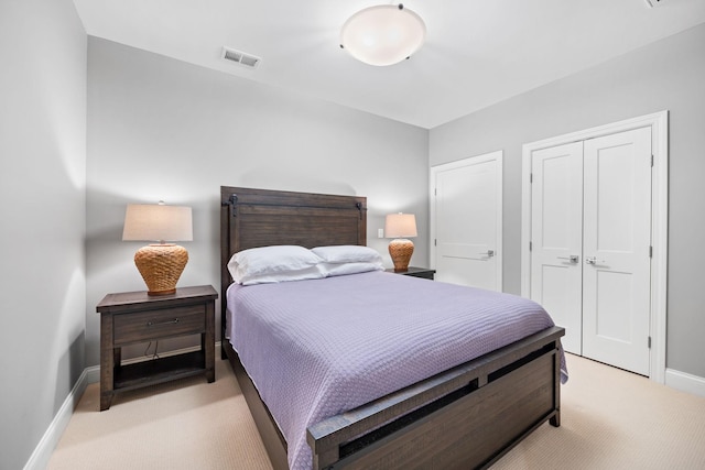 bedroom featuring light colored carpet