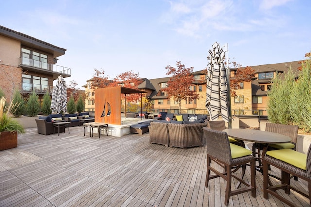 wooden deck featuring an outdoor living space