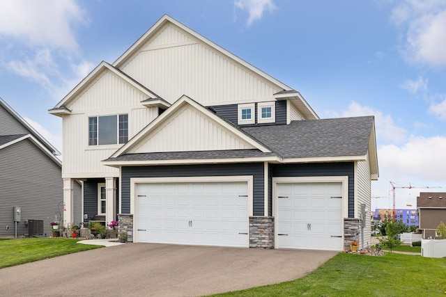 craftsman-style home featuring a garage and central air condition unit