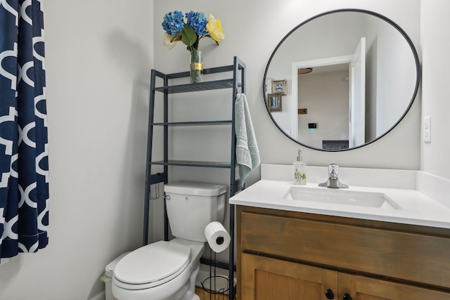 bathroom with vanity and toilet