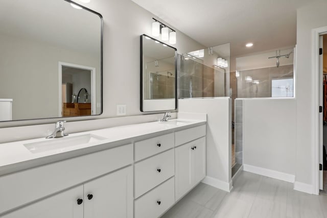 bathroom with vanity and a shower with shower door