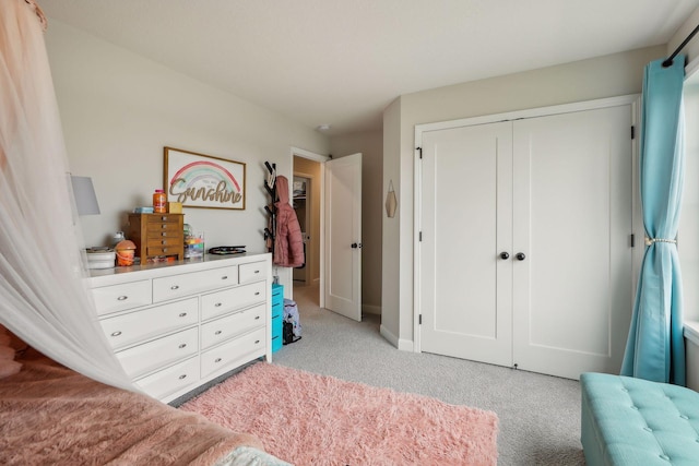 carpeted bedroom featuring a closet