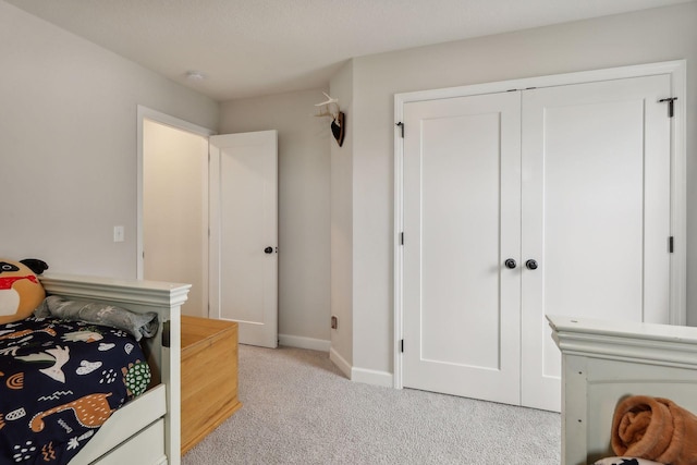 carpeted bedroom with a closet