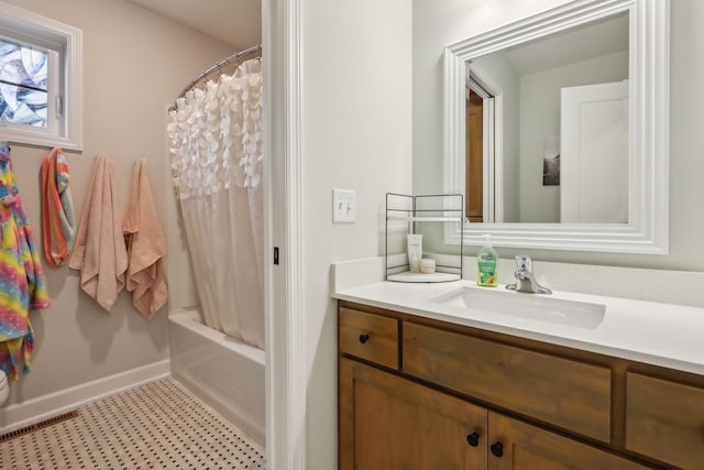 bathroom featuring vanity and shower / bath combination with curtain