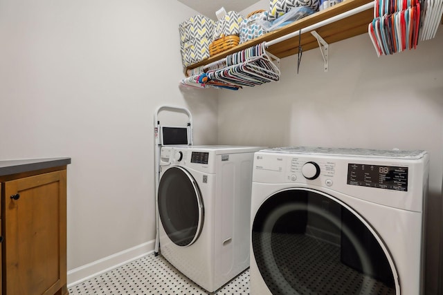 washroom featuring washer and clothes dryer