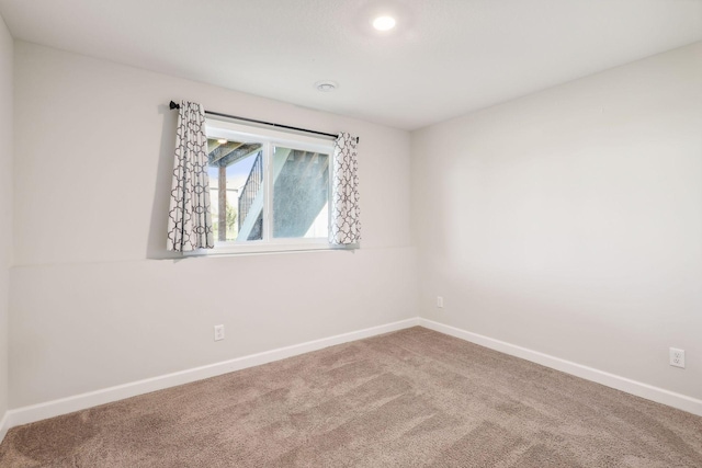 unfurnished room featuring carpet flooring