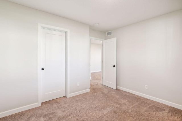 unfurnished bedroom with carpet floors